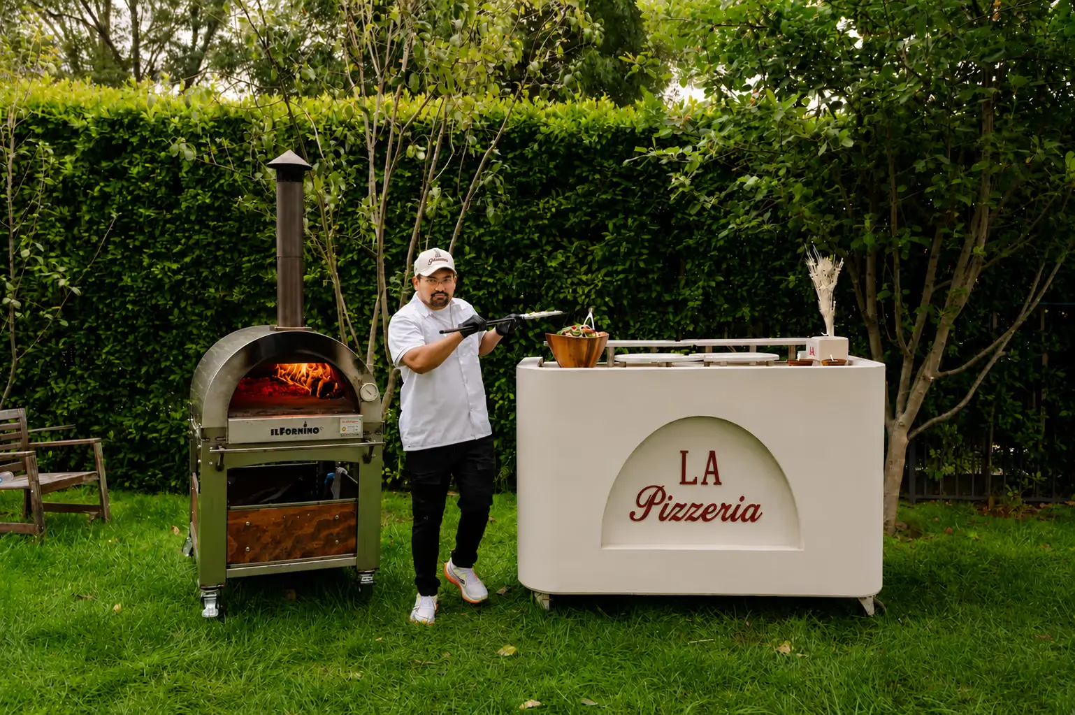 La Pizzeria chef preparing pizza dough at an event
