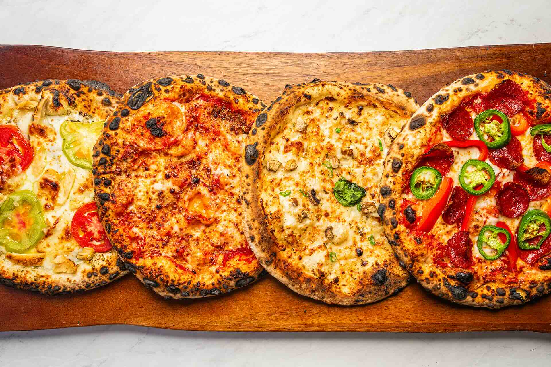 Wood-fired pizza buffet setup